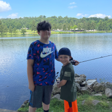 camp 2022 two boys fishing at lake royer