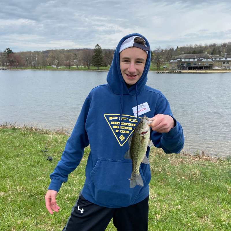 young boy with bass fishing at lake royer