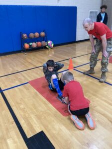winter camp 2022 - children completing fitness test with soldiers